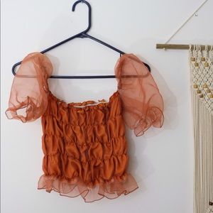 SOLD. Burnt orange puff sleeve blouse